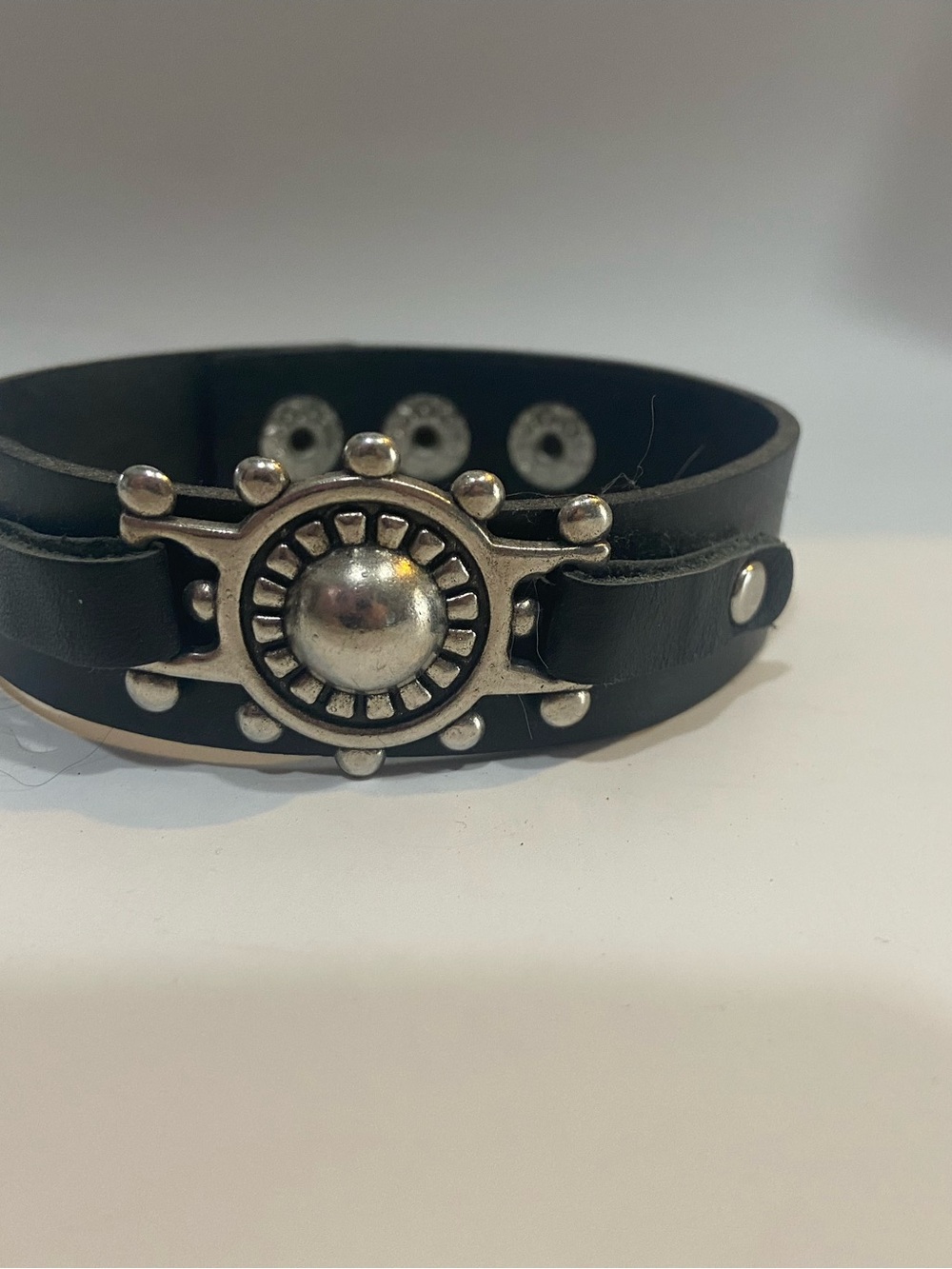 Black Faux Leather Strap Bracelet with Silver Sunburst Medallion